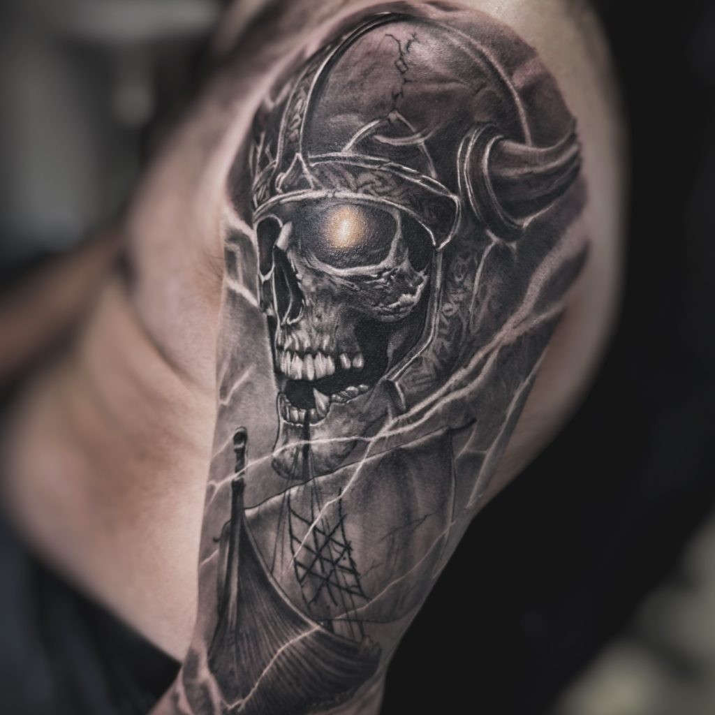 Detailed skull tattoo with ship imagery