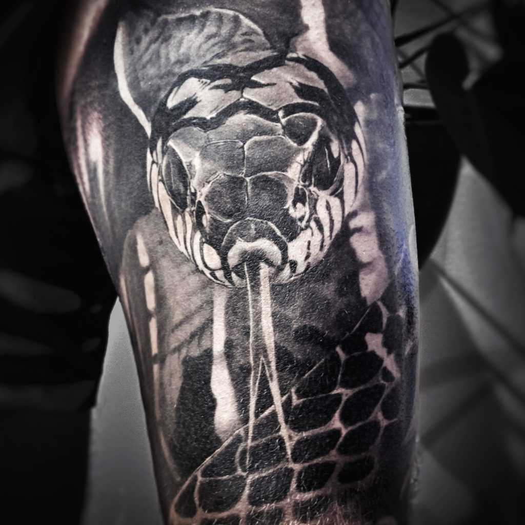 Realistic snake tattoo Helsinki