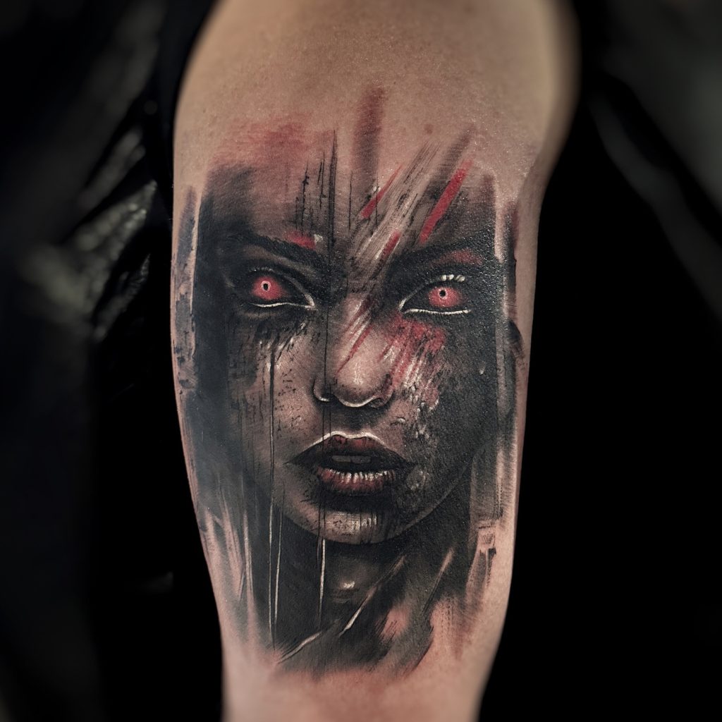 Realistic tattoo of a haunting face helsinki