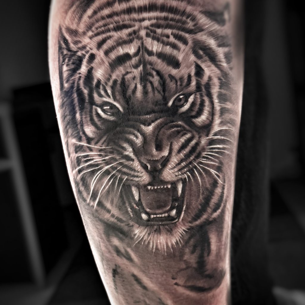 Realistic tiger tattoo on leg