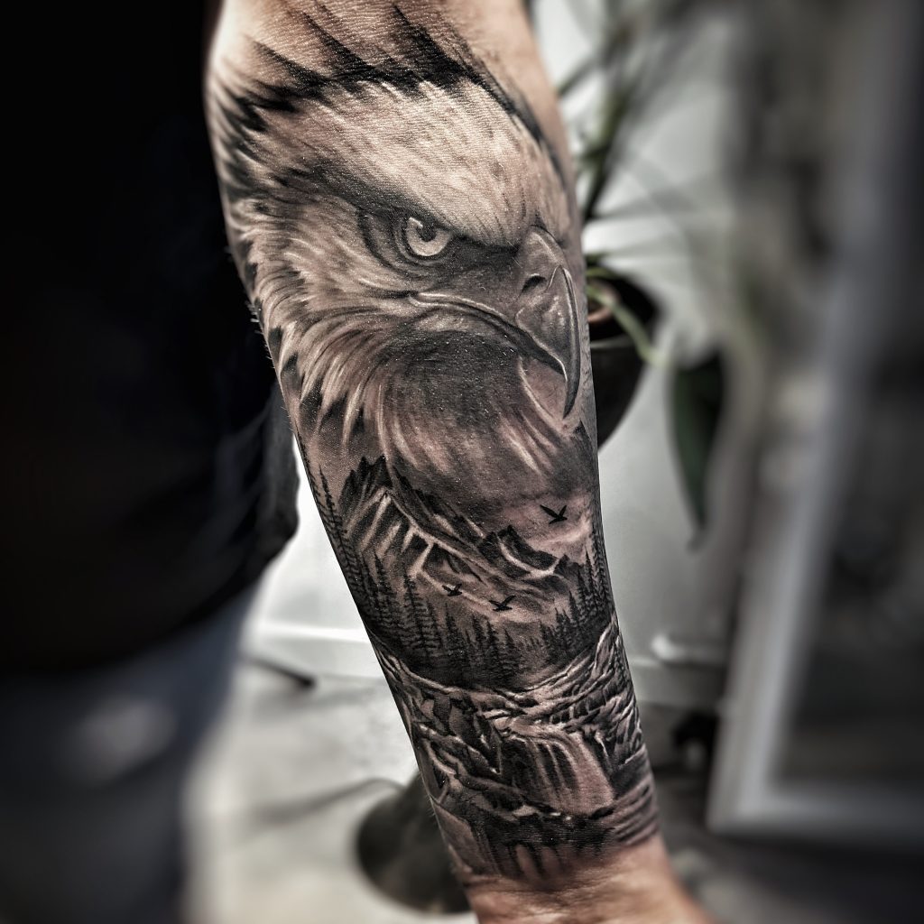 Detailed eagle tattoo on forearm.